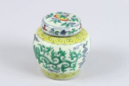 A CHINESE WUCAI GINGER JAR AND COVER.
