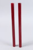 TWO RARE BAKELITE, POSSIBLY CHERRY AMBER, RODS. 10.5ins high. Weight 6ozs.