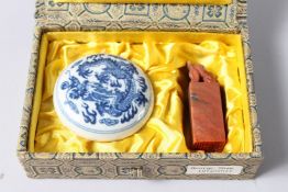 A SMALL CHINESE BLUE AND WHITE CIRCULAR POT, 2ins diameter, and a wax seal in a box.