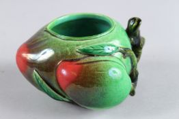 A CHINESE POTTERY PEACH BRUSH WASHER. 3ins high.