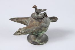 AN ANTIQUE 12TH CENTURY B.C. ISLAMIC BRONZE DOUBLE OIL LAMP. 3.5ins high.