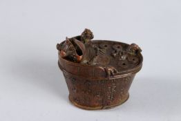 A JAPANESE BRONZE FROG in a bath. 2.5ins.