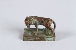 A CHINESE BRONZE TIGER SEAL on a rectangular base. 2.25ins x 1.25ins.