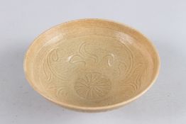A CHINESE BROWN BOWL. 6ins diameter.
