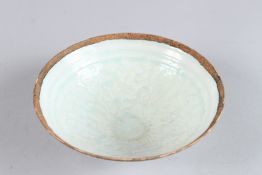 A CHINESE CREAM AND GREEN BOWL. 6.5ins diameter.