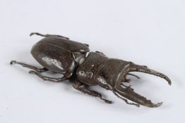 A JAPANESE OKIMONO BRONZE STAG BEETLE with articulated wing.
