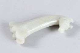 A CARVED JADE HORSE MUGHAL HANDLE. 6ins long.