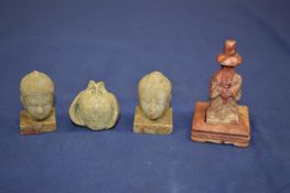 Carved hard stone miniature Buddhas heads etc.