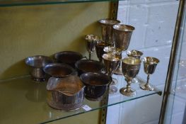 A plated bottle coaster, various goblets and plated cups.