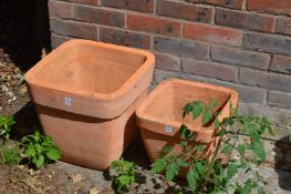 Two terracotta plant pots.