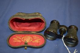 Cased pair of opera glasses.