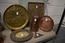 A group of Arts and Crafts metalware to include embossed copper tray, circular embossed brass