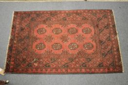 A small Persian rug, 120cm x 75cm.