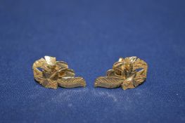 A pair of 9ct gold leaf shaped earrings.