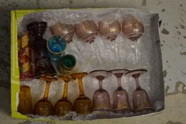A group of miniature etched and coloured glass liqueur glasses.