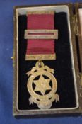 A cased medal.