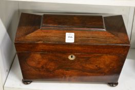 A Victorian rosewood sarcophagus shaped tea caddy.