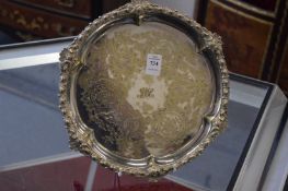 Decorative salver or waiter with engraved decoration.