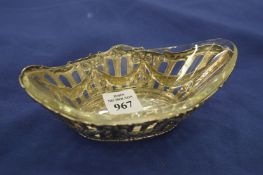 A French silver boat shaped dish with glass liner.