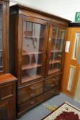 A 19th century mahogany two door bookcase with a single drawer below.