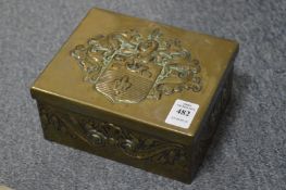An embossed brass box.