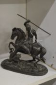 Spelter group of an Indian brave on horseback hunting a tiger.