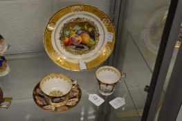 A good 19th century cabinet cup and saucer painted with alternating panels of birds and flowers