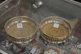 A good pair of silver wine coasters, London 1968.