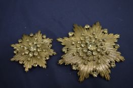 Charles Jourdan, two decorative star burst brooches.