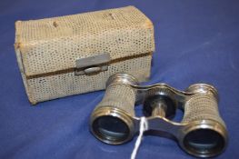 Cased pair of opera glasses.