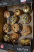 A collection of decorative porcelain musical boxes and covers.
