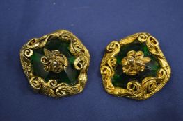 A pair of decorative ear clips.