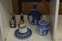 A Wedgwood Jasperware table match striker and similar items.