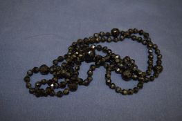 A jet bead necklace.