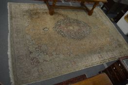 A large Persian carpet, cream ground with stylised floral decoration, 395cm x 265cm.