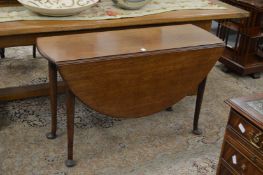 A 19th century mahogany oval drop-leaf gateleg dining table.