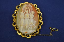A yellow metal mounted cameo, the three graces.