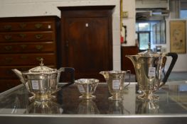 A silver four piece tea service.