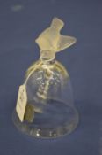 A Lalique table bell mounted with a bird.