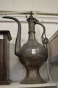 A large Islamic tinned copper ewer.