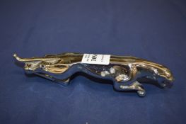 A Jaguar chrome car mascot.