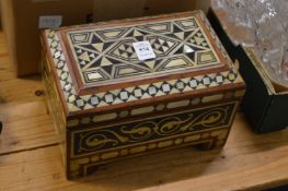 A bone and ebony inlaid casket.
