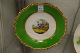 A Worcester cabinet plate decorated with an exotic bird.