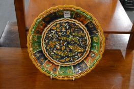 A Chinese sancai glazed moulded pottery dish.