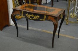 A good 19th century ebony, marquetry and ormolu mounted table of serpentine outline with a single