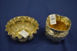 Two embossed silver bowls.