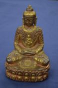 A cast brass Buddha.