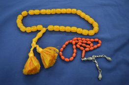 An amber style necklace etc.