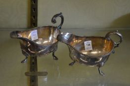 A near pair of Georgian style silver plated sauce boats.