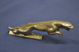 A Jaguar chrome car mascot.